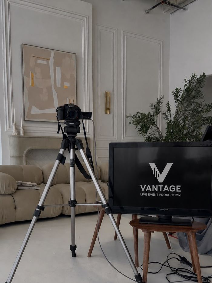 Camera on tripod with a Vantage-branded laptop